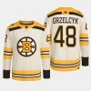 men bruins matt grzelcyk 2023 24 primegreen 100th anniversary authentic player cream jersey